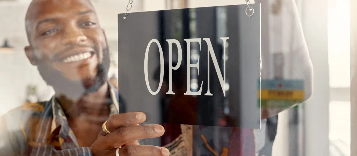 Smiling man hanging an 